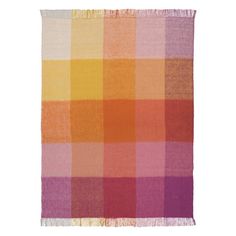 an orange, pink and yellow checkered blanket on a white background with fringes