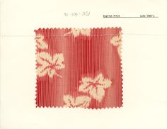 a piece of red and white paper with floral designs on the bottom half of it