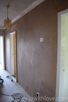 a room that is being painted with brown paint