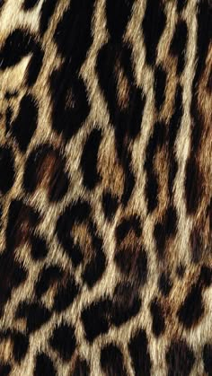 an animal print pattern is shown in brown and black