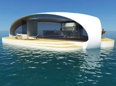 an unusual floating house in the middle of the ocean