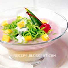 a bowl filled with food on top of a white plate