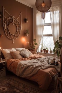 a bed in a bedroom with candles on the side and plants hanging from the ceiling