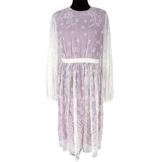 Burberry London White Lace Purple Lavender Sheer Long Sleeve Midi Dress Authentic New With The Tag Size: Us 8 (Uk 10) Material: 65% Cotton & 35% Polyester Lining 100% Silk Dry Clean White Embroidered Lace Dress Over A Purple Mesh & Silk Lining Round Neckline Sheer White Lace Long Balloon Sleeves With A Button Cuff Concealed Back Zipper Midi Length New With The Tag, Never Worn! Approx. Measurements: Across The Underarms: 18" Across The Waist: 15.5" Sleeve Length From The Underarms: 19.5" Length D Wrap Waist Dress, Artsy Dress, Plaid Tunic Dress, Silk Sheath Dress, Burberry Dress, Wool Sweater Dress, Bell Sleeve Shift Dress, Embroidered Lace Dress, Elegant Midi Dresses