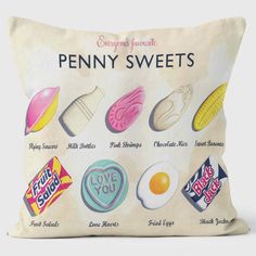 a pillow that has various types of candy on it and the words penny sweets written in different languages