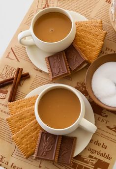 two cups of hot chocolate and some crackers