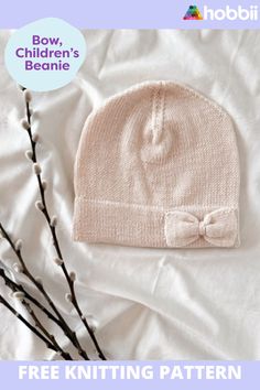 a knitted hat with a bow on it and the text free knitting pattern below