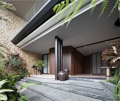 the interior of a modern house with plants and rocks