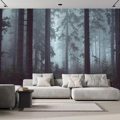 a living room filled with furniture and wallpaper covered in forest murals on the walls