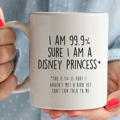 a woman holding a coffee mug with the words i am 99 9 % sure i am a disney princess