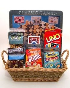 a basket filled with lots of different types of games and snacks on top of a table