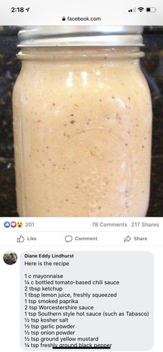 a jar filled with food sitting on top of a counter next to a facebook page