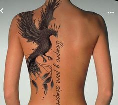 the back of a woman's body with an eagle tattoo on her upper half