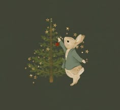 a white rabbit standing next to a christmas tree with gold stars on it's back