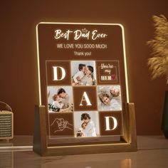 an illuminated photo frame with the words best dad ever