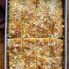 a casserole dish is shown with parmesan cheese