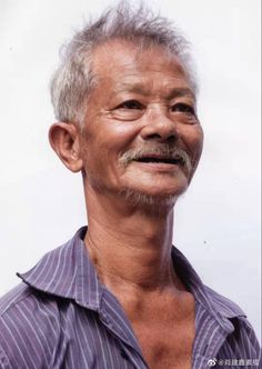 an older man with white hair and a mustache