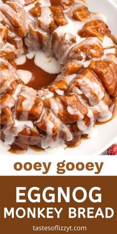 an eggnog monkey bread on a white plate with the words, ooey gooey eggnog monkey bread