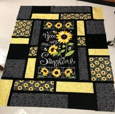 a quilt with sunflowers and the words you are my sunshine written on it