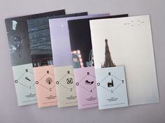 four different colored brochures with the eiffel tower in the back ground