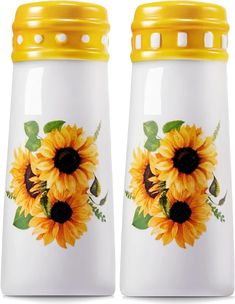 two yellow sunflowers on white ceramic salt and pepper shakers with yellow lids