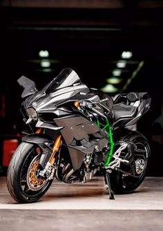 a black motorcycle parked in a parking garage