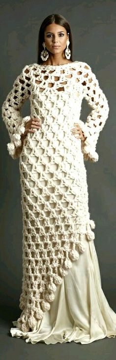 a woman in a white crochet dress