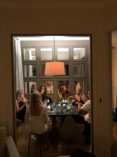 a group of people sitting around a table