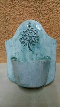 a ceramic bowl with a tree on it