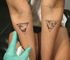 two people with matching tattoos on their legs