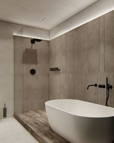 a large white bath tub sitting on top of a wooden counter next to a walk in shower