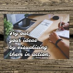 a person writing on a piece of paper next to a keyboard and monitor with the words try out your ideas by visualizing them in action