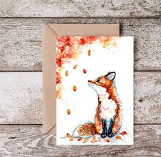 a card with a watercolor painting of a fox on it's front and back