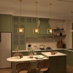 a large kitchen with green cabinets and white counter tops, along with two chairs at the table