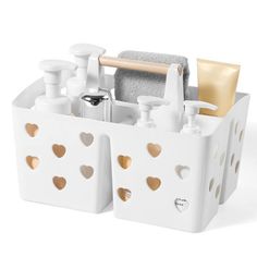 a white and gold bathroom caddy filled with personal care items on a white background