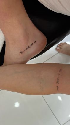 two people with tattoos on their legs and one has the words i love you written on it