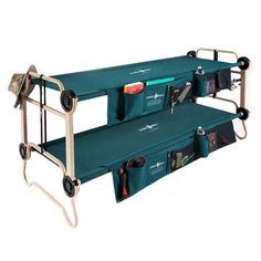 two green folding beds with wheels and storage pockets on each side, one is empty