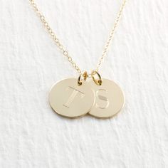 "Gorgeous double solid gold initial necklace... the perfect gift! PICTURE IS ENLARGED TO SHOW DETAIL! PLEASE READ BELOW FOR ACTUAL MEASUREMENTS!! Two solid gold 1/2\" discs have been personalized just for you with my 7mm typewriter font. The pendants are engraved with your choice of letters (entire alphabet in typewriter font shown in second picture) They hang from a solid 14k gold 1.5mm cable chain in either 16, 18, or 20\" in length. PLEASE REMEMBER PICTURES ARE TAKEN CLOSE UP TO SHOW DETAIL. Classic Gold Charm Necklaces With Polished Finish, Classic Initial Pendant Necklace With Polished Finish, Personalized 14k Gold Necklace With Polished Finish, Classic Hallmarked Initial Pendant Necklaces, Personalized 14k Gold Polished Necklace, Personalized 14k Gold Polished Finish Necklace, Classic Hallmarked Initial Pendant Necklace, 14k Gold Necklace With Polished Finish For Personalized Gift, 14k Gold Polished Finish Necklace For Personalized Gift