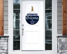 a welcome sign on the front door of a house