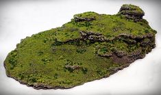 moss covered rock formation on white background