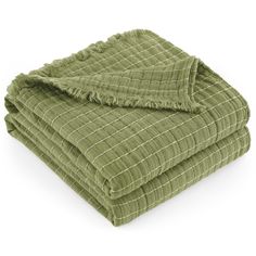 a green blanket folded on top of each other