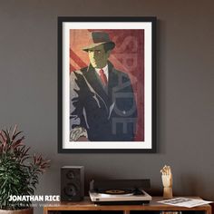 a man in a suit and hat is hanging on the wall next to a book shelf