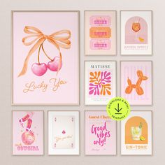 there are many greeting cards on the wall with different designs and colors, including cherries