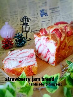 the strawberry jam bread has been sliced and is ready to be eaten on the table