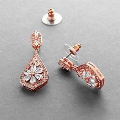 two pairs of rose gold earrings with diamonds