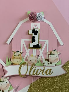 a pink and white barn with farm animals on it's side, the number one is