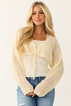 Cream Open Crochet Cropped Cardigan with Tank Top Open Knit Open Front Top For Fall, Fall Open Front Open Knit Tops, Long Sleeve Cotton Shrug For Fall, Winter Open Knit Open Front Top, Winter Open Front Open Knit Top, Long Sleeve Open Knit Shrug For Layering, Casual Knit Shrug For Spring, Winter Open Knit Shrug For Layering, White Long Sleeve Shrug For Fall