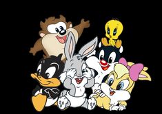 several cartoon characters are grouped together on a black background, with one character smiling at the camera