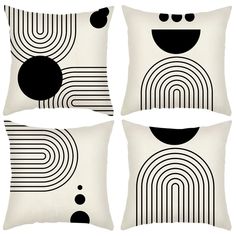 four pillows with black and white designs on them