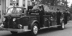 an old black and white photo of a fire truck